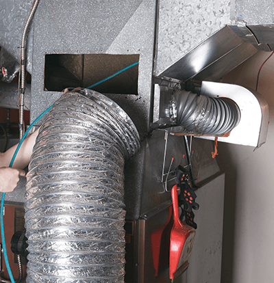 Duct cleaning services being performed in Palm Beach County.